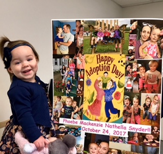 Phoebe and her Happy Adoption Day board