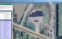 Closer view of property shows aerial photos